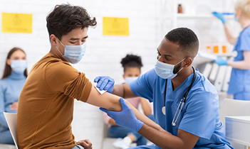Image of a person being vaccinated by a nurse