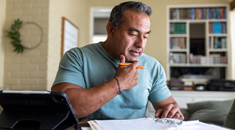 Person reviewing resources on a computer.